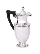 AN EDWARDIAN SILVER OCTAGONAL HOT WATER JUG