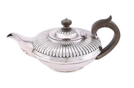 A WILLIAM IV SILVER CIRCULAR HALF LOBED TEA POT