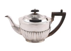A VICTORIAN SILVER OVAL HALF LOBED TEA POT