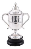 A SILVER TWIN HANDLED TROPHY CUP AND COVER
