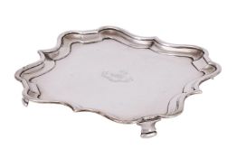 AN EDWARDIAN SILVER SHAPED SQUARE SALVER