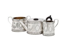 A VICTORIAN MATCHED SILVER OVAL THREE PIECE TEA SET