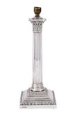 AN EDWARDIAN SILVER CORINTHIAN CANDLESTICK CONVERTED TO A LAMP
