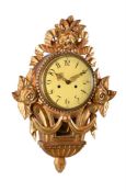 A SWEDISH CARVED GILTWOOD CARTEL CLOCK