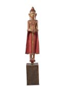 Y A CARVED AND POLYCHROMED FIGURE OF A STANDING ATTENDANT
