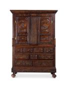 A LARGE CONTINENTAL CARVED OAK PRESS CUPBOARD POSSIBLY NORTHERN FRANCE