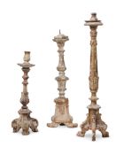 THREE ITALIAN BAROQUE CARVED SOFTWOOD ALTAR CANDLESTICKS, 17TH CENTURY AND LATER