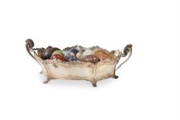 A GROUP OF HARDSTONE EGGS IN A SILVER-PLATED BASKET