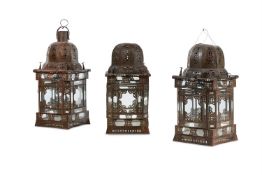 A SET OF THREE MORROCAN PIERCED METAL HANGING LANTERNS, 20TH CENTURY