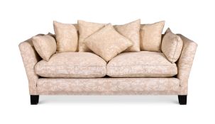 A CREAM UPHOLSTERED TWO SEAT SOFA, MODERN