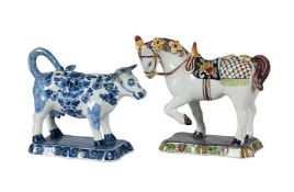 A DUTCH DELFT POLYCHROME MODEL OF A SADDLED HORSE AND A BLUE AND WHITE COW-CREAMER, CIRCA 1900