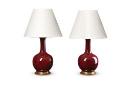 A PAIR OF CHINESE SANG DE BOEUF VASE TABLE LAMPS