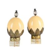 A PAIR OF OSTRICH EGGS MOUNTED ON STANDS, PROBABLY OTTOMAN PROVINCES, 20TH CENTURY