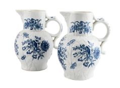 A PAIR OF WORCESTER BLUE AND WHITE PRINTED CABBAGE-LEAF MOULDED MASK JUGS, CIRCA 1780