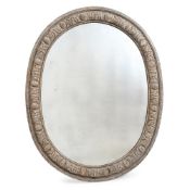 A CARVED AND PAINTED OVAL MIRROR IN GEORGE III STYLE, 19TH CENTURY