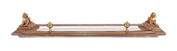 A STEEL AND BRASS FIRE FENDER IN THE EMPIRE STYLE, LAST QUARTER 19TH CENTURY