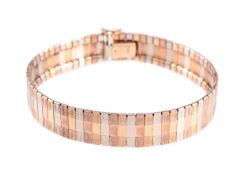 A TRI-COLOUR TRACK LINK BRACELET