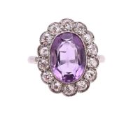 AN AMETHYST AND DIAMOND CLUSTER RING
