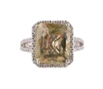 A LEMON QUARTZ AND DIAMOND CLUSTER RING