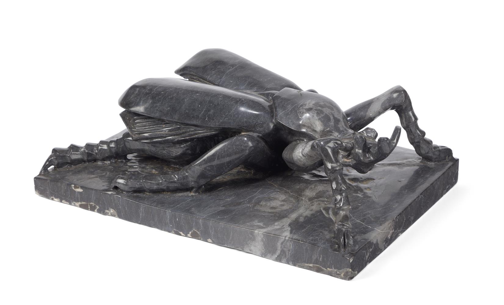 A LARGE BLACK MARBLE MODEL OF A BEETLE ITALIAN
