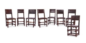 A MATCHED SET OF EIGHT OAK AND BRASS-STUDDED LEATHER CHAIRS, VARIOUS DATES, 17TH /19TH CENTURY