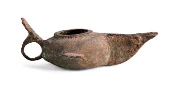 AN ISLAMIC BRONZE OIL LAMP, POSSIBLY 9TH CENTURY