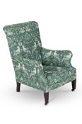 IN MANNER OF HOWARD & SONS; AN UPHOLSTERED ARMCHAIR; FIRST QUARTER 20TH CENTURY