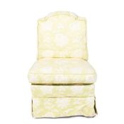 AN UPHOLSTERED LOW SIDE CHAIR, RECENTLY MANUFACTURED BY HOWARD CHAIRS LTD