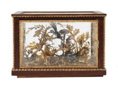 A GILT-METAL DIORAMA OF COLD PAINTED MAGPIES IN A WOODLAND SETTING, 20TH CENTURY