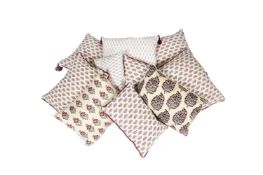 A GROUP OF TEN VARIOUS CUSHIONS, MAINLY COVERED IN FLORAL FABRICS