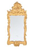 A CARVED GILTWOOD WALL MIRROR, 19TH CENTURY, IN ITALIAN STYLE