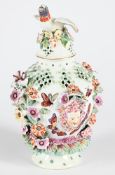 A DERBY PORCELAIN FLOWER-ENCRUSTED 'FRILL' VASE AND COVER, CIRCA 1765, AND A PAIR OF WHITE VASES