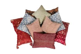 A GROUP OF NINE VARIOUS CUSHIONS, MAINLY COVERED IN FLORAL FABRICS