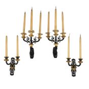 TWO PAIRS OF GILT AND PATINATED BRONZE WALL LIGHTS, IN THE EMPIRE MANNER
