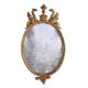 A LARGE GEORGE III CARVED GILTWOOD OVAL MIRROR, AFTER DESIGNS BY ROBERT ADAM, CIRCA 1780 - Image 1 of 2