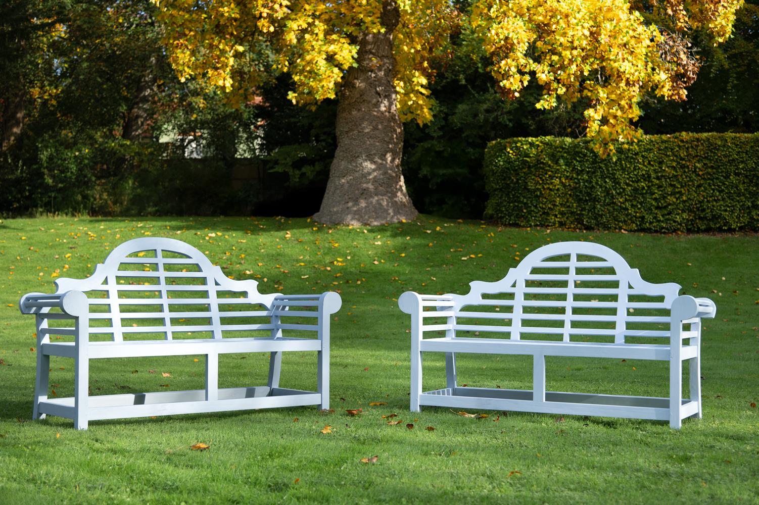 A PAIR OF PAINTED HARDWOOD GARDEN BENCHESAFTER DESIGNS, BY SIR EDWIN LUTYENS, 20TH CENTURY