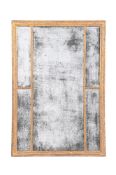 A GEORGE III CARVED GILTWOOD MIRROR, CIRCA 1785