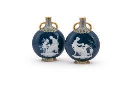 A FINE PAIR OF MINTON PÂTE SUR PÂTE MOON FLASKS, BY MARC-LOUIS SOLON