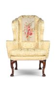 A GEORGE I WALNUT WING ARMCHAIR, CIRCA 1720