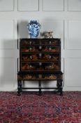 A QUEEN ANNE BLACK LACQUER AND GILT JAPANNED CHEST ON STAND, CIRCA 1710