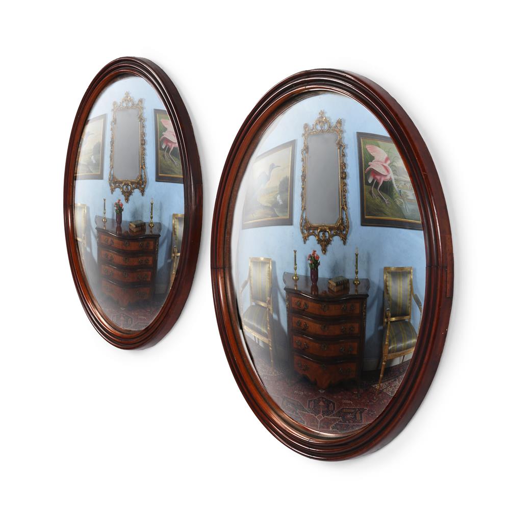 A PAIR OF UNUSUAL MAHOGANY FRAMED CONVEX MIRRORS, SECOND HALF 19TH CENTURY