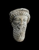 A LARGE CYPRIOT LIMESTONE HEAD OF A MALE DIGNITARY, LATE 6TH CENTURY B.C. OR EARLY 5TH CENTURY B.C.