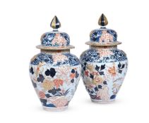 A LARGE PAIR OF IMARI STYLE JARS AND COVERS, LATE 19TH CENTURY