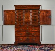 A GEORGE I BURR WALNUT AND WALNUT CABINET ON CHEST, CIRCA 1720
