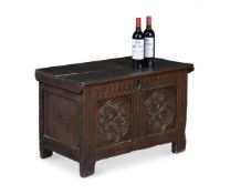 AN UNUSUAL SMALL CHARLES I CARVED AND PANELLED OAK CHEST OR COFFER, POSSIBLY GLOUCESTERSHIRE