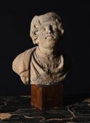 A CARVED STONE HEAD OF A WOMAN, POSSIBLY ROMANO CELTIC, 3RD CENTURY
