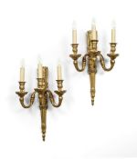 A PAIR OF NAPOLEON III GILT BRONZE THREE BRANCH WALL LIGHTS, AFTER A MODEL BY THOMIRE