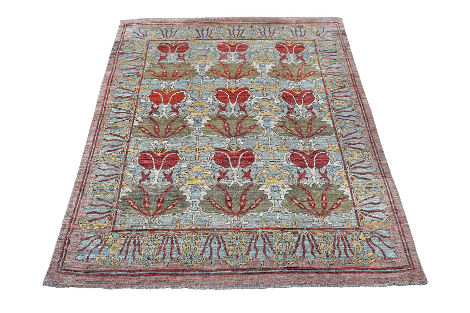 AN USHAK CARPET, AFTER DESIGNS BY C. F. A. VOYSEY, approximately 442 x 354cm