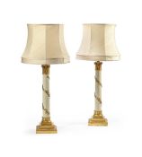A LARGE PAIR OF GILT AND CREAM CORINTHIAN TABLE LAMPS, 20TH CENTURY