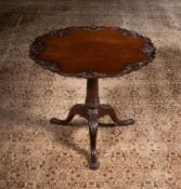 A CARVED MAHOGANY TRIPOD TABLE, IN GEORGE II STYLE, 19TH CENTURY